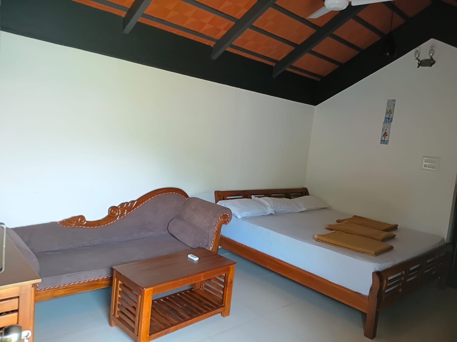 Cottage bedroom with a double bed and a window