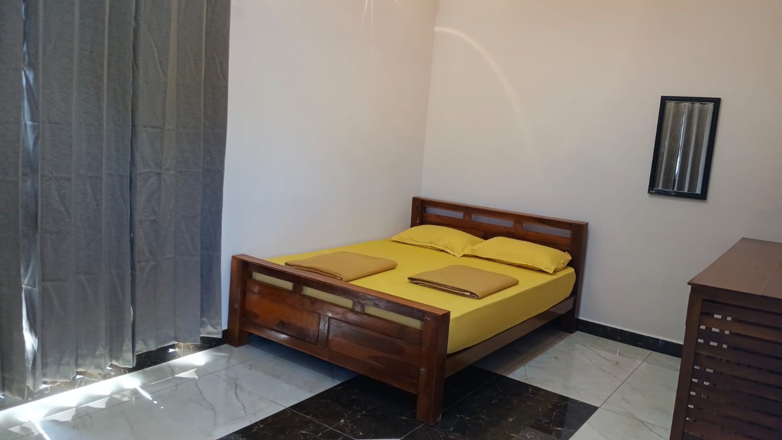 Deluxe room with a balcony overlooking misty hills